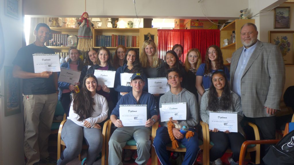 Showing off our certificates of completion for Elf School.